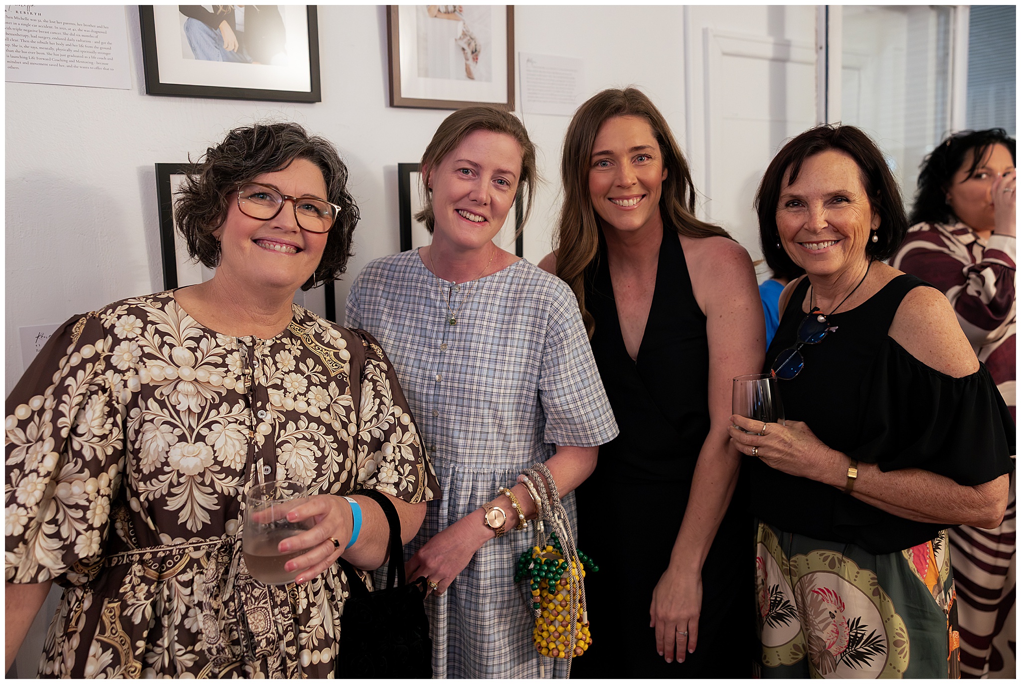 Three women laughing together at the 40 Over 40 Project celebration